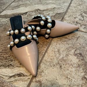 Shu Shop mule flats 
Closed toe slides featuring pearl embellished dual straps